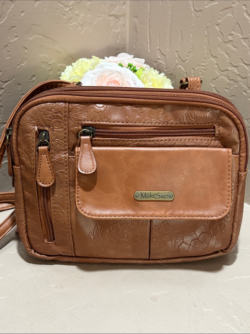 MùltìSac Zippy Embossed Floral Crossbody Bag - Cognac